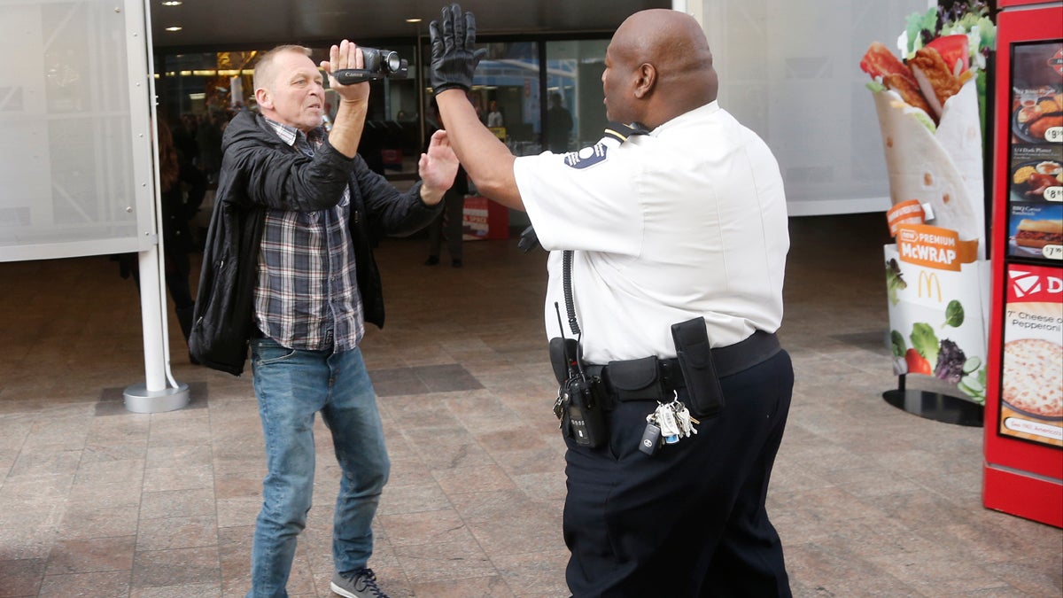  Associated Press video journalist Bill Gorman is prevented by a security guard from filming a protest inside the Smithsonian's National Air and Space Museum in Washington, Thursday, Dec. 5, 2013. (Charles Dharapak/AP Photo, file) 