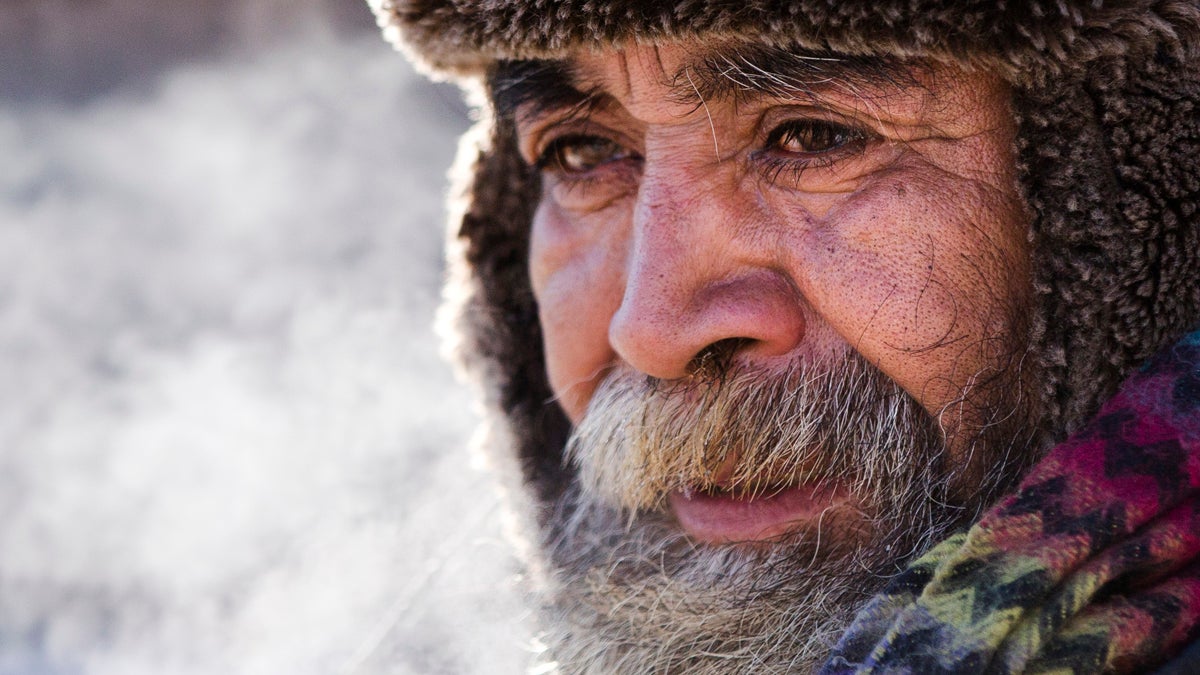  A homeless man comes in out of the cold after speaking with an outreach worker (Matt Rourke/AP Photo) 