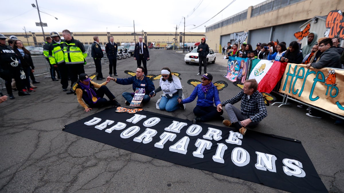 Activists block a street as police officers look on during an immigration protest outside of a detention center, Thursday, Feb. 23, 2017, in Elizabeth, N.J. (Julio Cortez/AP Photo) 