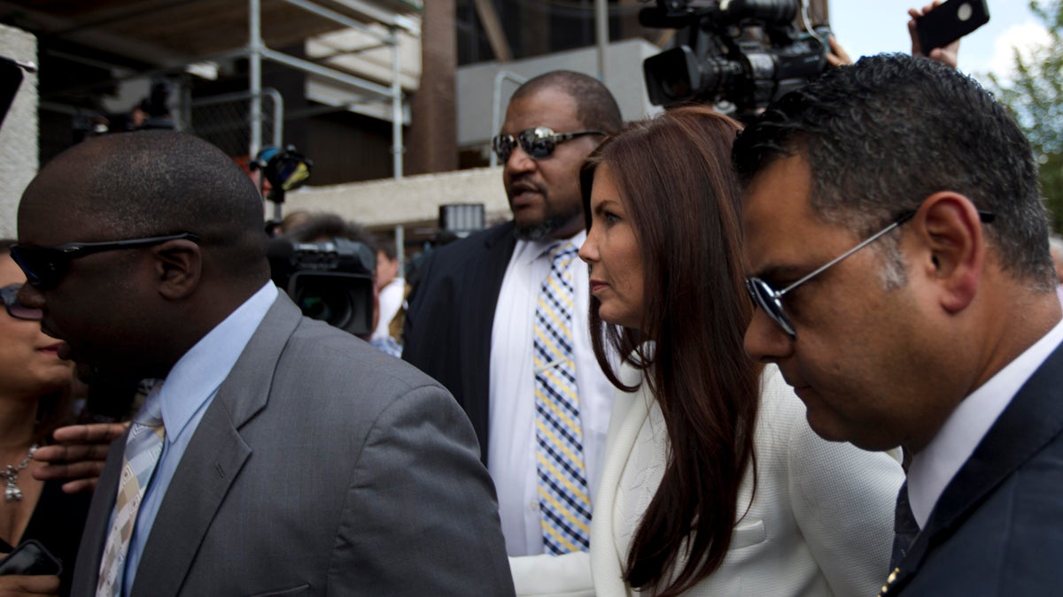 Pennsylvania Attorney General Kathleen Kane arrives to be processed and arraigned on charges she leaked secret grand jury material and then lied about it under oath, Saturday, Aug. 8, 2015, at the Montgomery County detective bureau in Norristown, Pa. (Laurence Kesterson/AP Photo) 