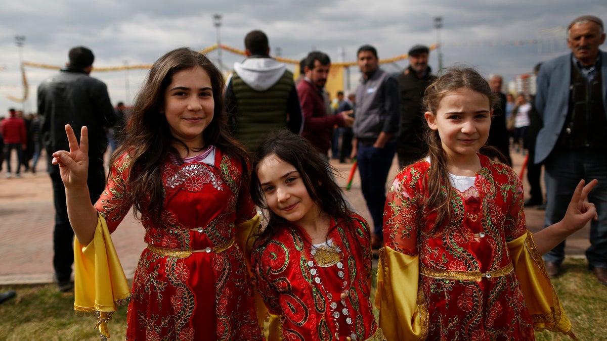  Children in traditional Kurdish clothing, pose for the photographer during the Newroz celebration, in Diyarbakir, southeastern Turkey, Tuesday, March 21, 2017. Thousands celebrated the Newroz festival in Istanbul and in Diyarbakir, a mainly Kurdish city in a region where Kurdish militants regularly clash with government forces. In Turkey, the spring festival traditionally serves as an occasion to demand more rights for the Kurdish minority.(Lefteris Pitarakis/AP Photo)                                            