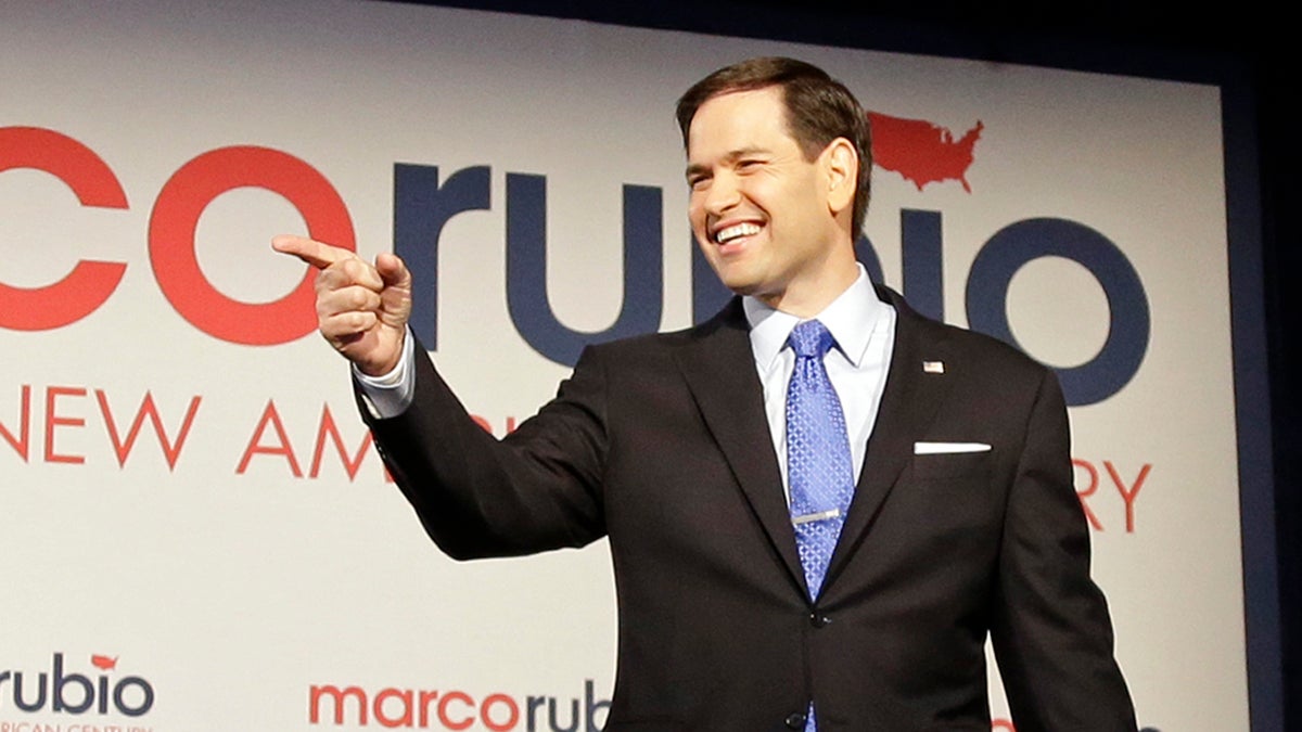  Florida Sen. Marco Rubio points to supporters as he arrives before announcing he is running for the Republican nomination, at a rally at the Freedom Tower, Monday, April 13, 2015, in Miami. (Alan Diaz/AP Photo) 