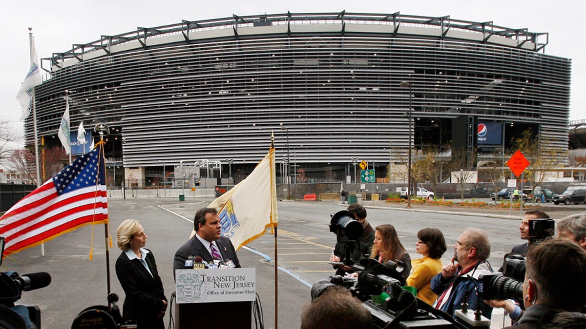  In this Nov. 13, 2009, file photograph, New Jersey's Lt. Gov. Kim Guadagno, (left), listens as Gov. Chris Christie answers a question outside the Meadowlands stadium in East Rutherford, N.J. (Mel Evans/AP File Photo) 