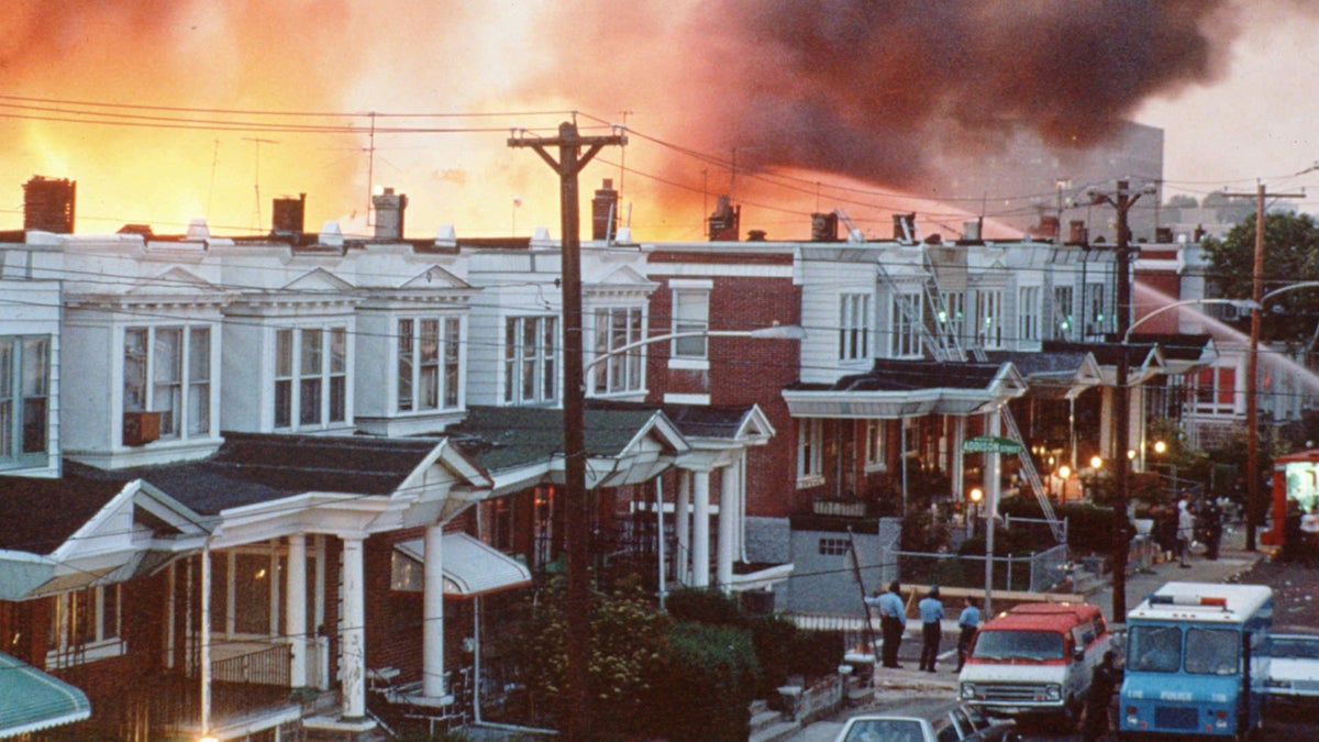 Rowhouses in Philadelphia burn after authorities dropped a bomb on the MOVE house in May 1985.