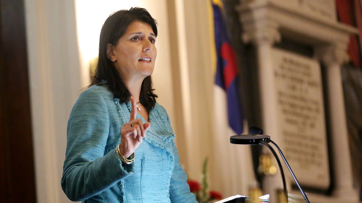  In this June 18, 2015, file photo, South Carolina Gov. Nikki Haley addresses a full church during a prayer vigil held at Morris Brown AME Church for the victims of the shooting at Emanuel AME Church in Charleston, S.C. Haley said the shooter who gunned down nine people inside a historic black church in Charleston should be put to death. (Grace Beahm/The Post And Courier via AP, Pool, File) 