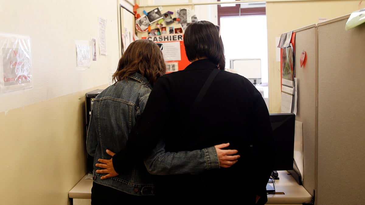  Carolyn Caton, left, and Noelle Foizen wait for their marriage license at the Philadelphia Marriage Bureau in City Hall, Tuesday, May 20, 2014, in Philadelphia. Pennsylvania's ban on gay marriage was overturned by a federal judge Tuesday. (Matt Slocum/AP Photo) 