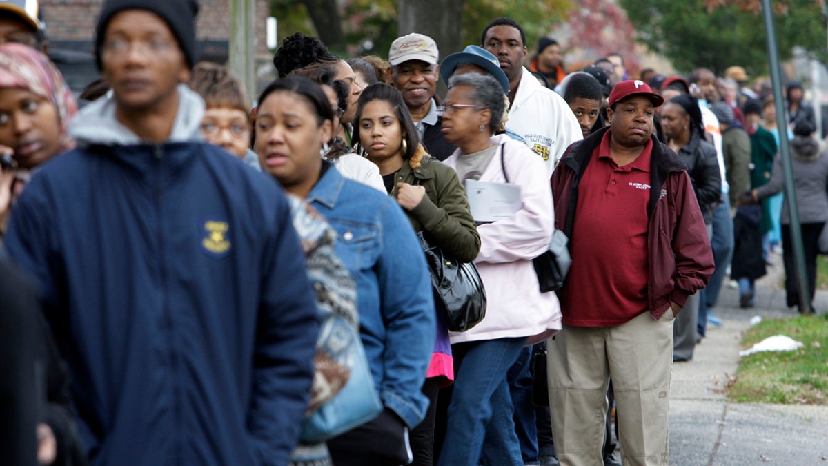 Voters wait in line to cast their votes in Philadelphia
