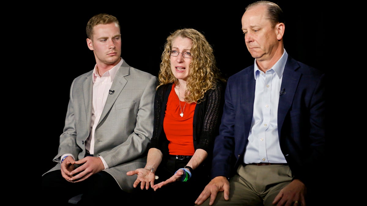  Evelyn Piazza, center, seated with her husband James, right, and son Michael, left, speaks during an interview on Monday May 15, 2017, in New York. The Piazza's talked about Timothy Piazza, 19, a brother, son and Penn State sophomore who died in February after he was put through a hazing ritual at his fraternity house and forced to drink dangerous amounts of alcohol in a short amount of time. (Bebeto Matthews/AP Photo)                                                              