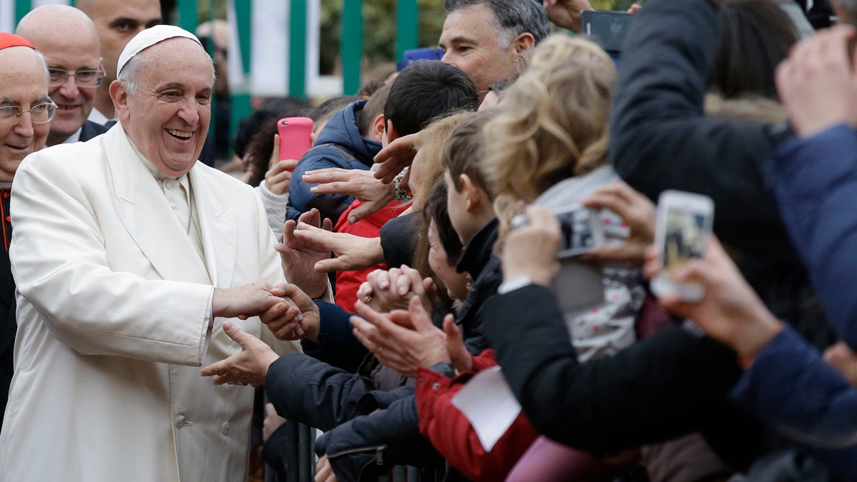  Pope Francis greets admirers last month in Rome. (Gregorio Borgia/AP Photo) 