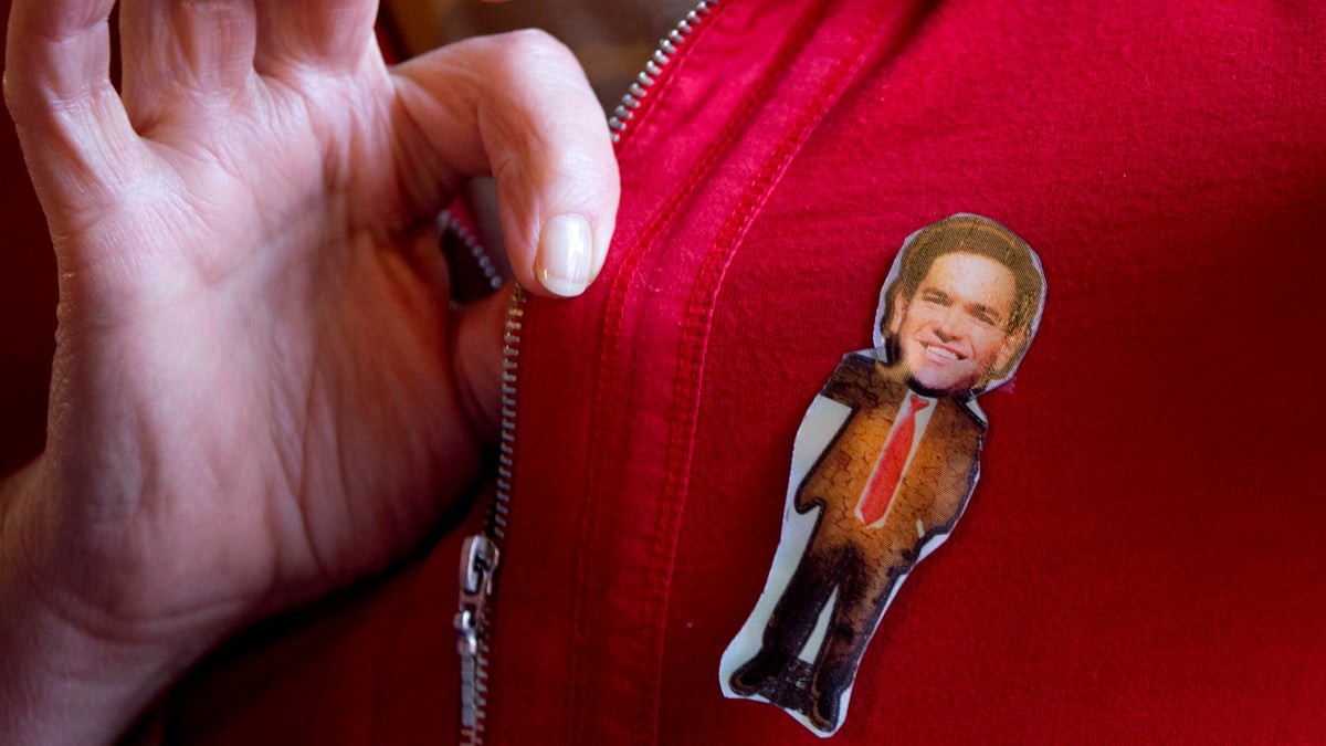  Susan Mielbrecht of Moultonboro, N.H., wears a hologram of Republican presidential candidate, Sen. Marco Rubio, R-Fla. while attending a town hall meeting in Laconia, N.H., Wednesday Feb. 3, 2016. (Jacquelyn Martin/AP Photo) 