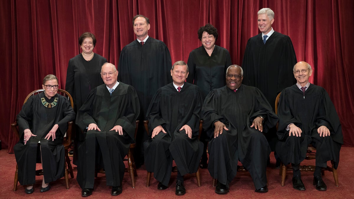  The justices of the U.S. Supreme Court gather for an official group portrait to include new Associate Justice Neil Gorsuch, top row, far right, at the Supreme Court Building in Washington, Thursday. June 1, 2017. Seated in bottom row are, from left, Associate Justice Ruth Bader Ginsburg, Associate Justice Anthony M. Kennedy, Chief Justice of the United States John G. Roberts, Associate Justice Clarence Thomas, and Associate Justice Stephen Breyer. Standing in top row are, from left, Associate Justice Elena Kagan, Associate Justice Samuel Alito Jr., Associate Justice Sonia Sotomayor, and Associate Justice Neil Gorsuch. (J. Scott Applewhite/AP Photo)  