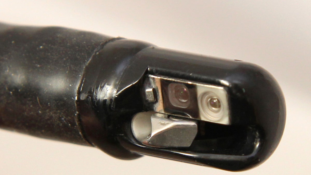  This undated photo provided by the U.S. Food and Drug Administration shows the tip of an endoscopic retrograde cholangiopancreatography (ERCP) duodenoscope, attached to a long tube, not shown. A 'superbug' outbreak is raising disturbing questions about the design of a hard-to-clean medical instrument used on more than half a million people in the U.S. every year. (US Food and Drug Administration/AP Photo) 