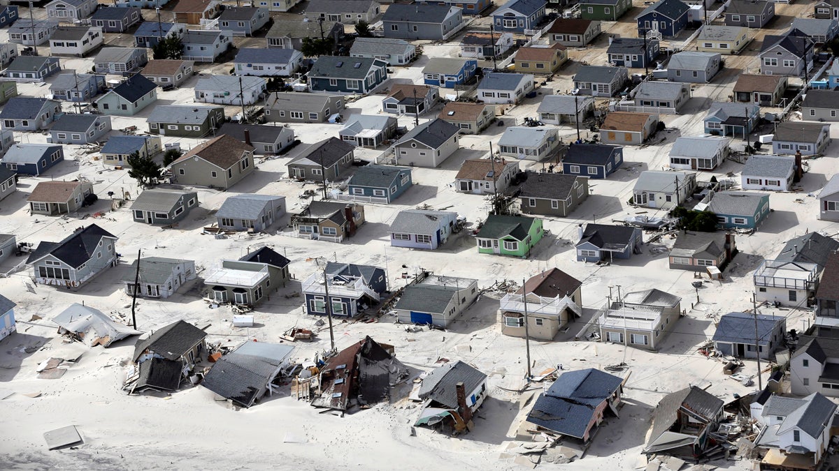 In this aerial photo, sand fills the streets in the wake of Superstorm Sandy, Wednesday, Oct. 31, 2012, along the central Jersey Shore. (Mike Groll/AP Photo)  