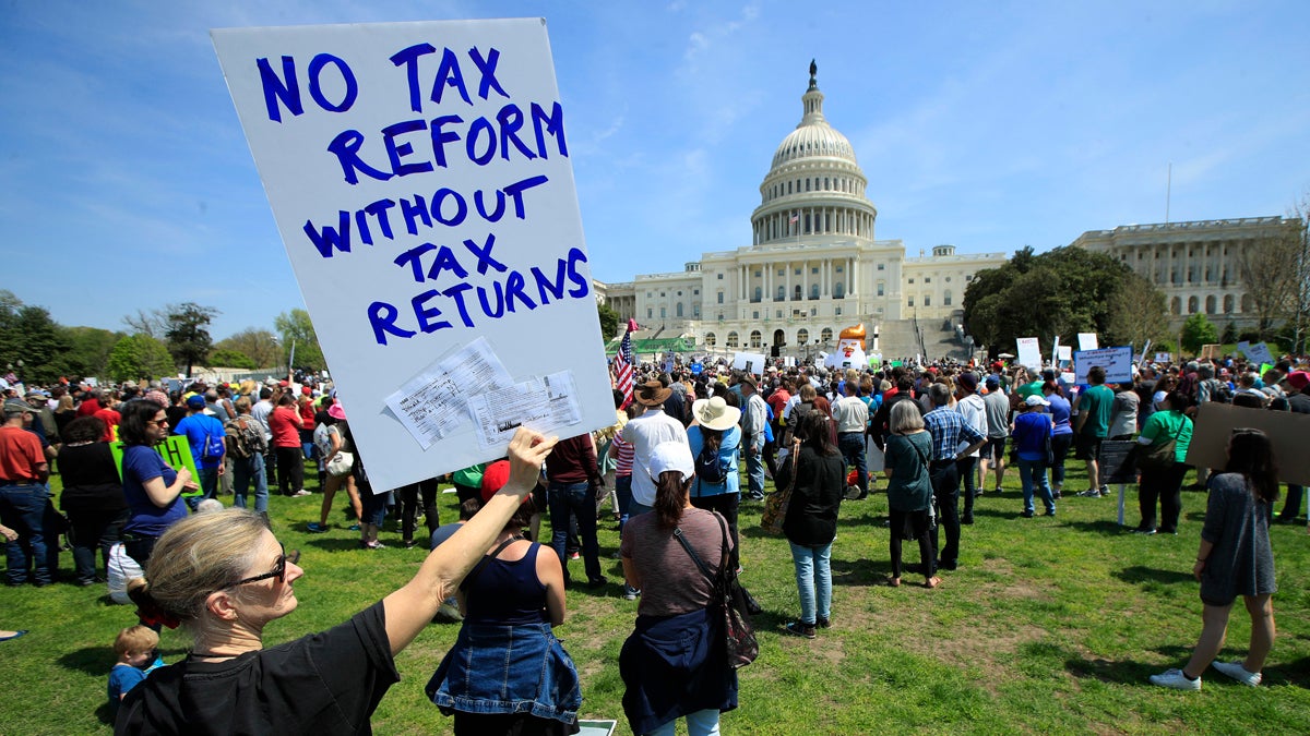 Protesters are gather on Capitol Hill in Washington, Saturday, April 15, 2017, during a Tax Day demonstration calling on President Donald Trump to release his tax returns. (AP Photo/Manuel Balce Ceneta)