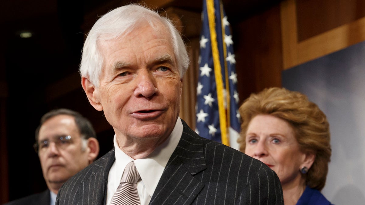  This Feb. 4, 2014 file photo shows Sen. Thad Cochran, R-Miss, center, speaking during a news conference on Capitol Hill in Washington. Cochran is flanked by Sen. John Boozman, R-Ark., left, and Debbie Stabenow, D-Mich. (J. Scott Applewhite/AP Photo, file) 