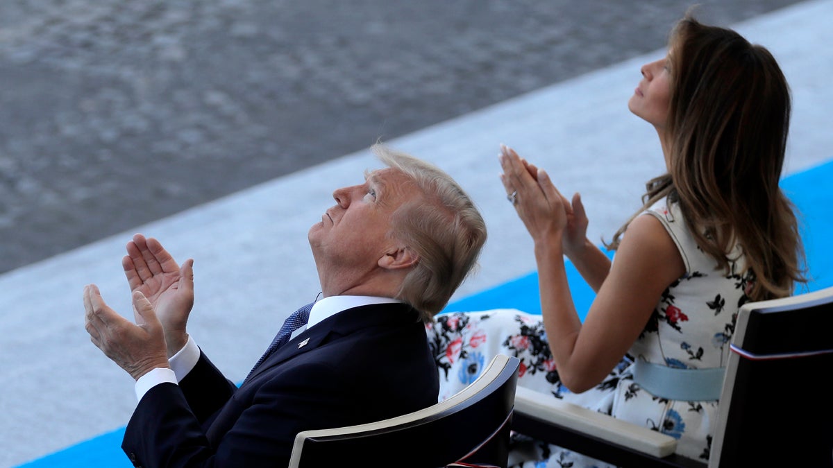  U.S President Donald Trump and First Lady Melania Trump applaud the aerial show during Bastille Day parade in Paris, Friday, July 14, 2017. (Markus Schreiber/AP Photo) 