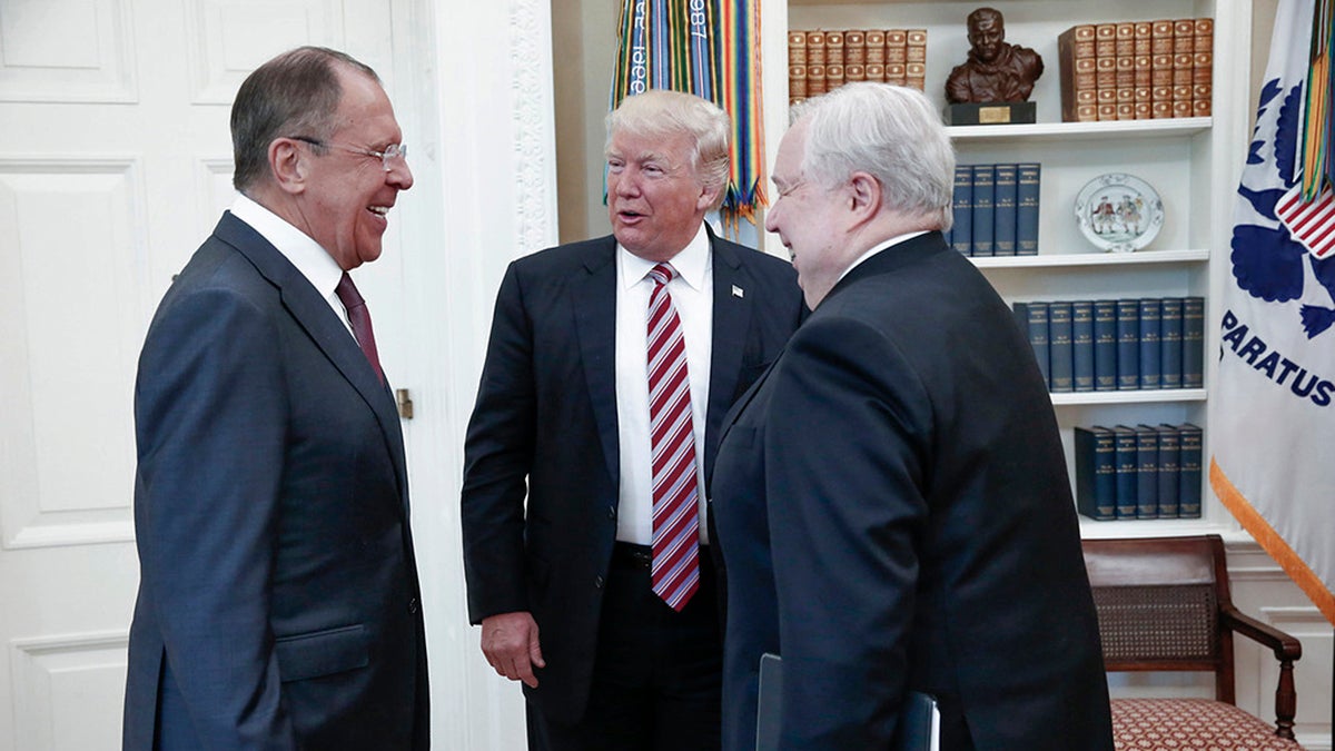  President Donald Trump meets with Russian Russian Foreign Minister Sergey Lavrov, (left), in the White House in Washington, Wednesday, May 10, 2017. At right is Russian Ambassador to USA Sergei Kislyak. President Donald Trump on Wednesday welcomed Vladimir Putin's top diplomat to the White House for Trump’s highest level face-to-face contact with a Russian government official since he took office in January. (Russian Foreign Ministry Photo via AP) 