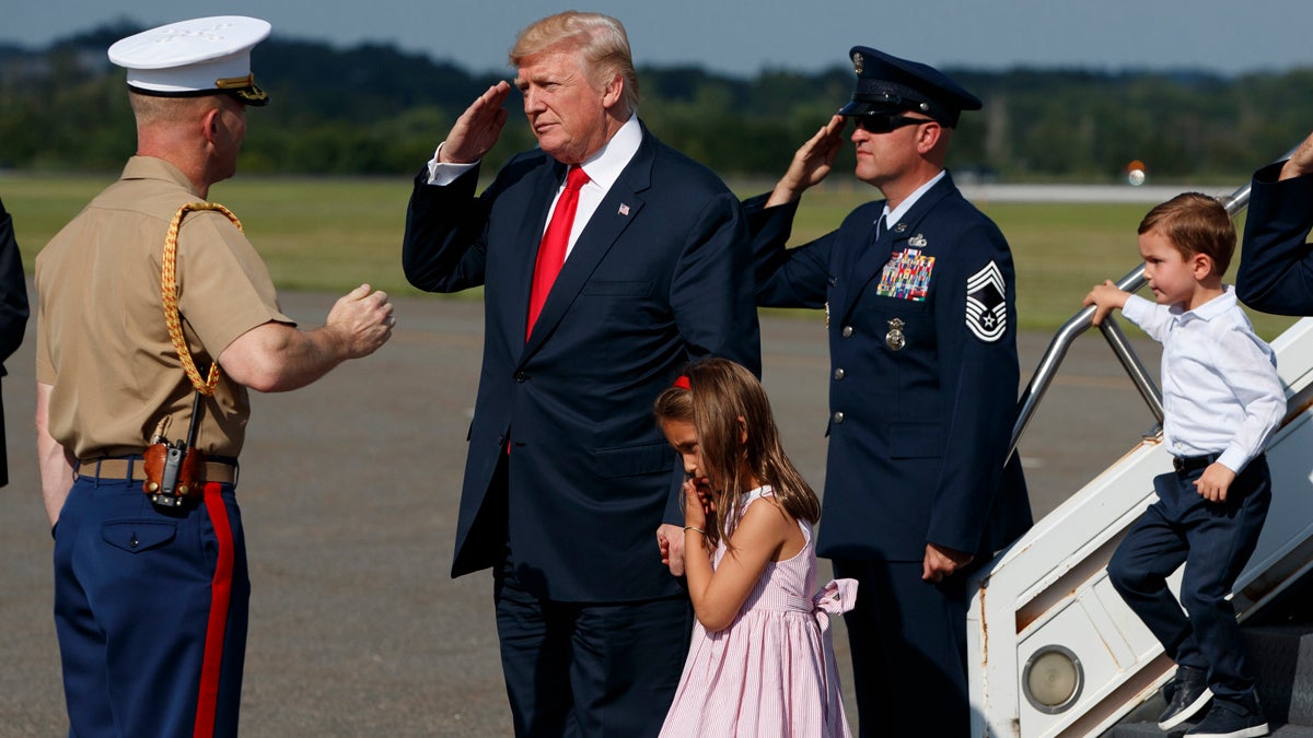  President Donald Trump salutes after walking down the steps of Air Force One with his grandchildren, Arabella and Joseph Kushner, after arriving at Morristown Municipal Airport to begin his summer vacation at his Bedminster golf club, Friday, Aug. 4, 2017, in Morristown, N.J. (Evan Vucci/AP Photo) 