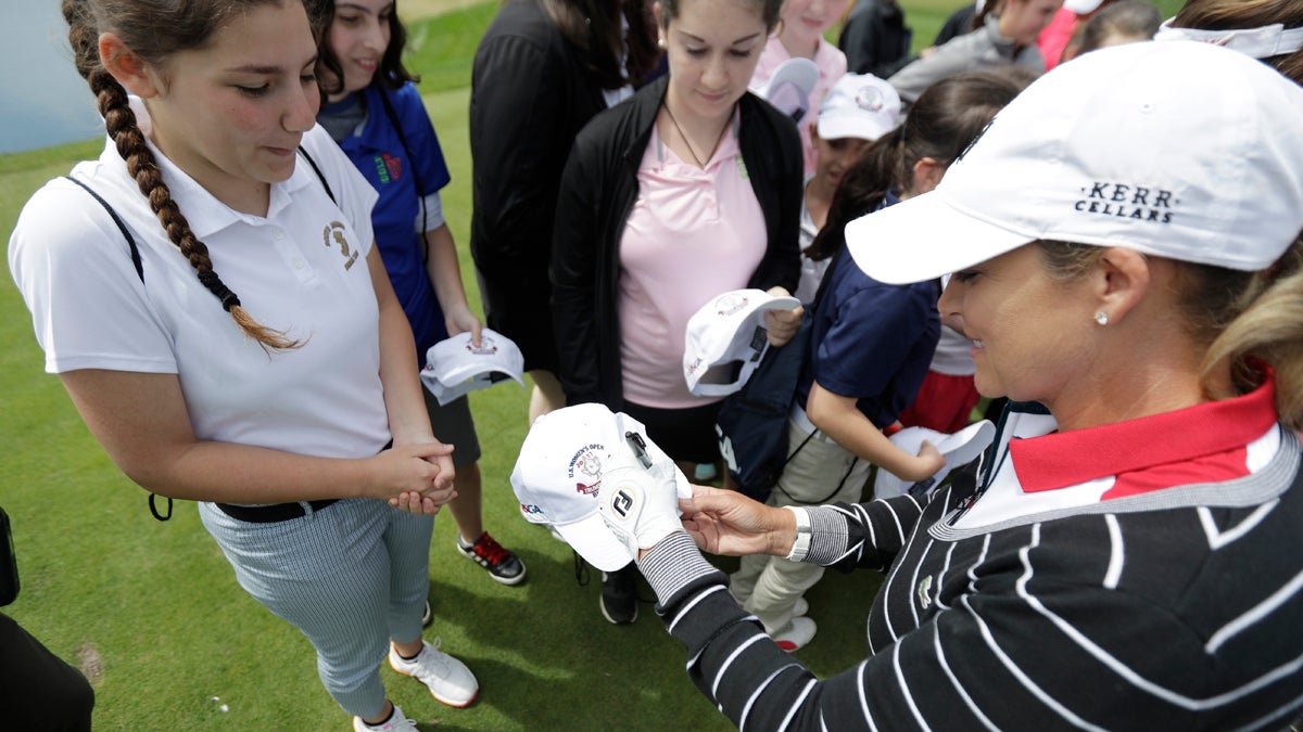  Professional golfer Cristie Kerr, (right), signs autographs during a media event at Trump National Golf Club, which is scheduled to host the U.S. Women's Open Championship, Wednesday, May 24, 2017, in Bedminster, N.J. (Julio Cortez/AP Photo) 