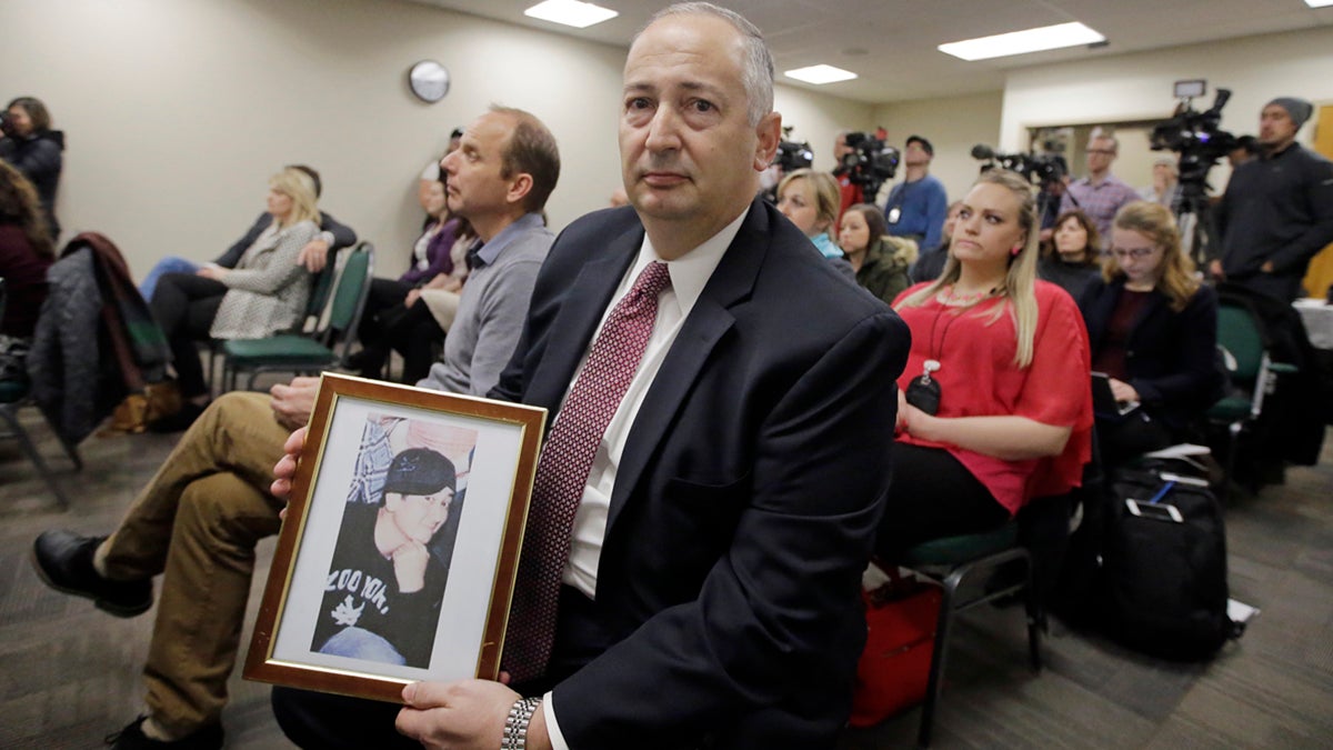  Mark Lewis, holds a photograph of his 27-year-old son who died from a heroin overdose, during a Utah Department of Health press conference where Utahns who have lost a family member to an opioid overdose as well as those who have overcome heroin and prescription opioid addictions shared their stories Wednesday, Jan. 25, 2017, in Salt Lake City. (Rick Bowmer/AP Photo) 
