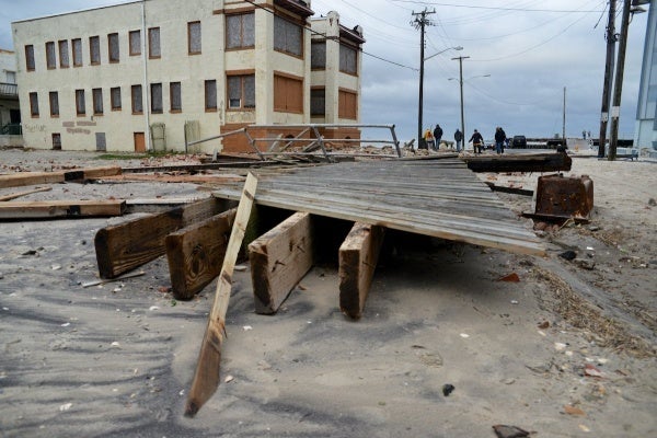 <p><p>A section of the destroyed AC boardwalk is found in the street half a block from its original position. (Bas Slabbers/for NewsWorks)</p></p>
