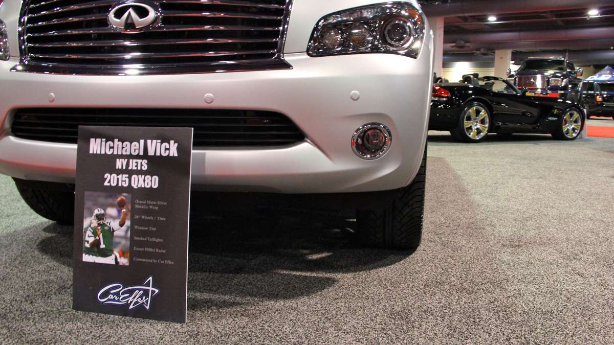 Michael Vick's customized SUV and the cars of other celebrities can be seen at the Philadelphia Auto Show. (Emma Lee/WHYY)