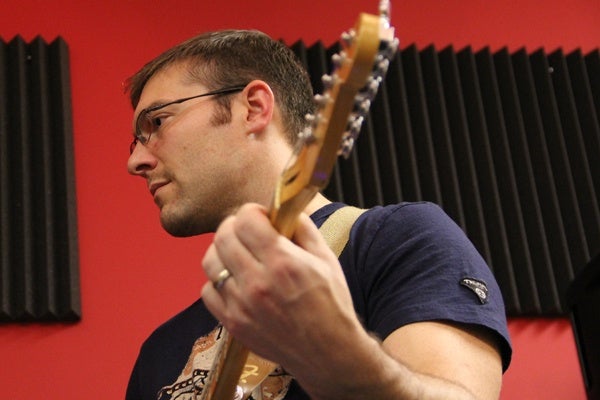 <p><p>Brian McNally plays guitar with his Article 15 band mates during a rehearsal in Cherry Hill. (Emma Lee/for NewsWorks)</p></p>
