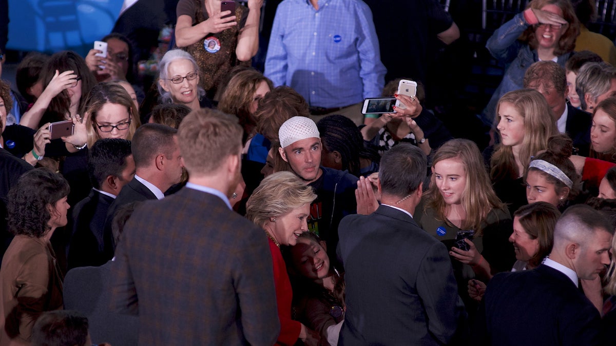  Jonathan Lee Riches is seen in close proximity to Democratic presidential nominee Hillary Clinton as she greets and takes selfies with voters after an Oct. 4, 2016, Family Town Hall in Haverford, Pennsylvania. (Bastiaan Slabbers for NewsWorks) 