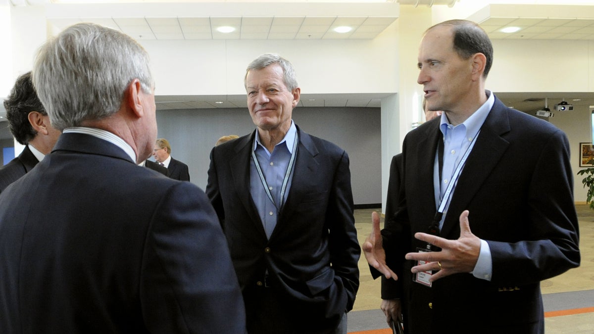  Senate Finance Committee Chairman Sen. Max Baucus, D-Mont., left, and the House Ways and Means Committee Chairman, Rep. Dave Camp, R-Mich., talk about tax reform to 3M executives in Maplewood, Minn., on their tour of the country to rally support for their effort to overhaul the nation’s tax laws. (AP Photo/Hannah Foslien, File) 