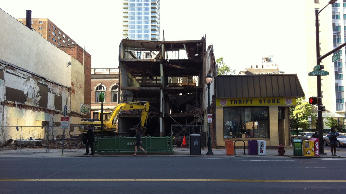  The four-story building being demolished before it collapsed onto the Salvation Army Thrift Store, Wednesday morning, June 5, 2013.  Six people are dead and at least 14 others were injured in the Center City collapse. (AP Photo/Luis Cornejo) 