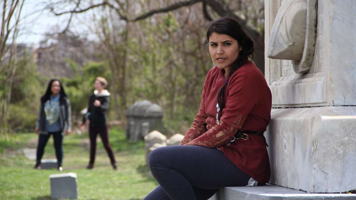 Merri Rashoyan plays the poet and several other characters in The Renegade Company's version of Beowulf to be performed at Mount Moriah Cemetery. (Emma Lee/WHYY)
