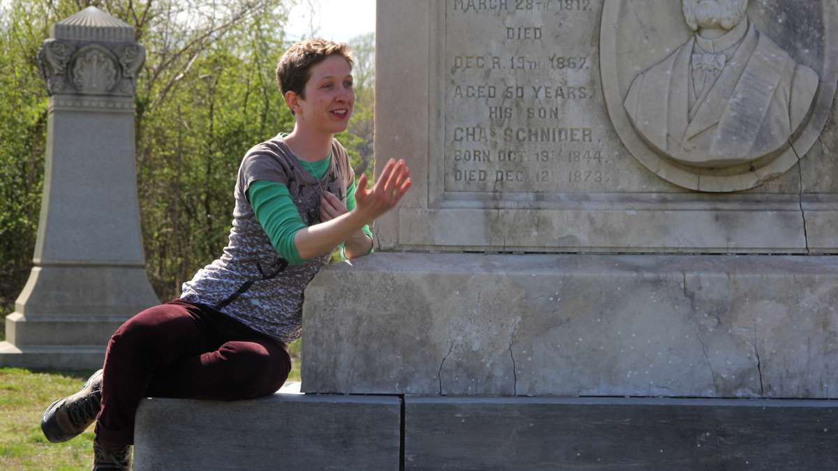 Maura Krause directs a rehearsal of Beowulf/Grendel from the base of a towering monument at Mount Moriah Cemetery in West Philadelphia. (Emma Lee/WHYY)