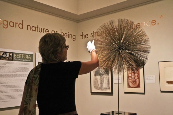 Michener Museum Director and CEO Lisa Hanover curated this show of Harry Bertoia's monoprints, jewelry and sculptures. (Kimberly Paynter/WHYY)