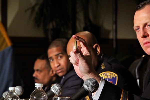 <p>Springettsbury Police Chief Thomas Hyers holds up a bullet of the type used in the Sandy Hook Elementary School shootings during a press conference with Vice President Joe Biden at Girard College. (Emma Lee/for NewsWorks)</p>
