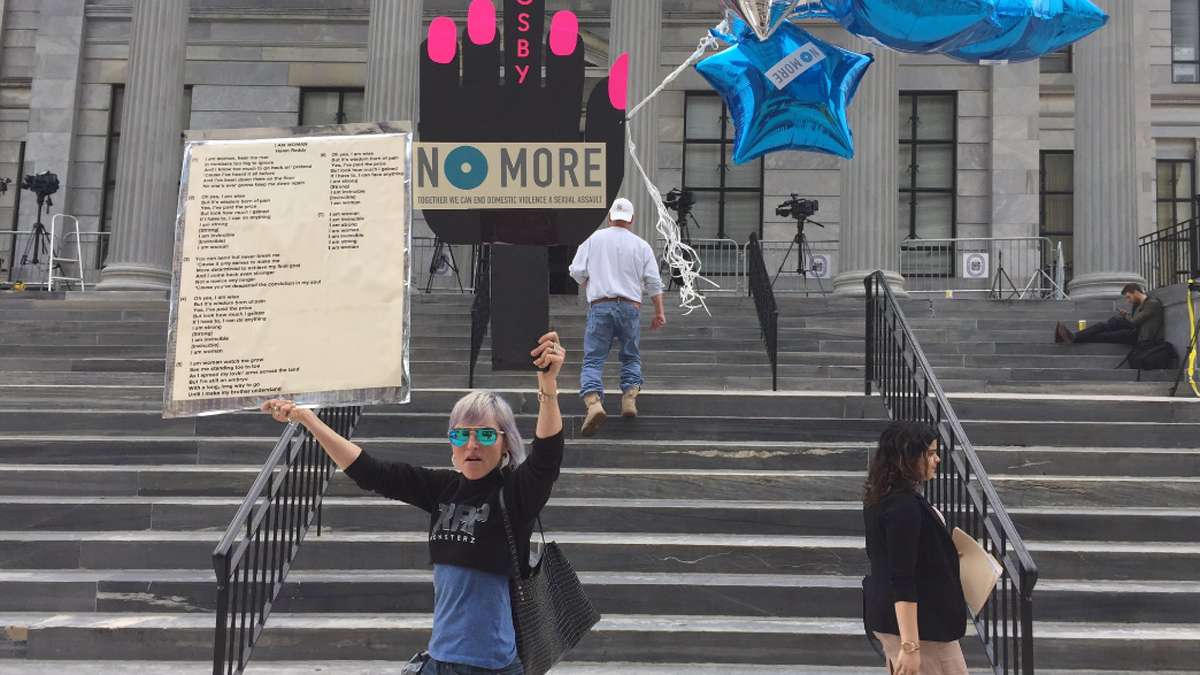 Artist Bird Milliken mounts a musical protest outside of the Montgomery County Courthouse to support Bill Cosby's accusers, and victims of sexual abuse.