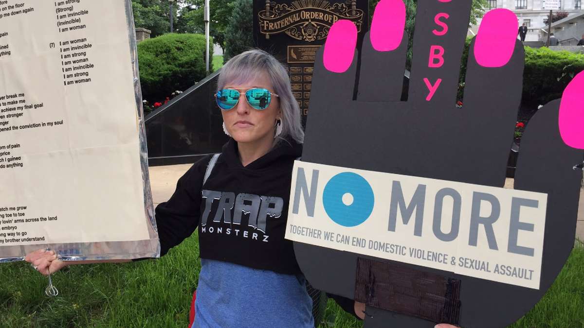 Artist and activist Bird Milliken stands outside of the Montgomery County Courthouse where the sexual abuse trial of Bill Cosby is in its fourth day.