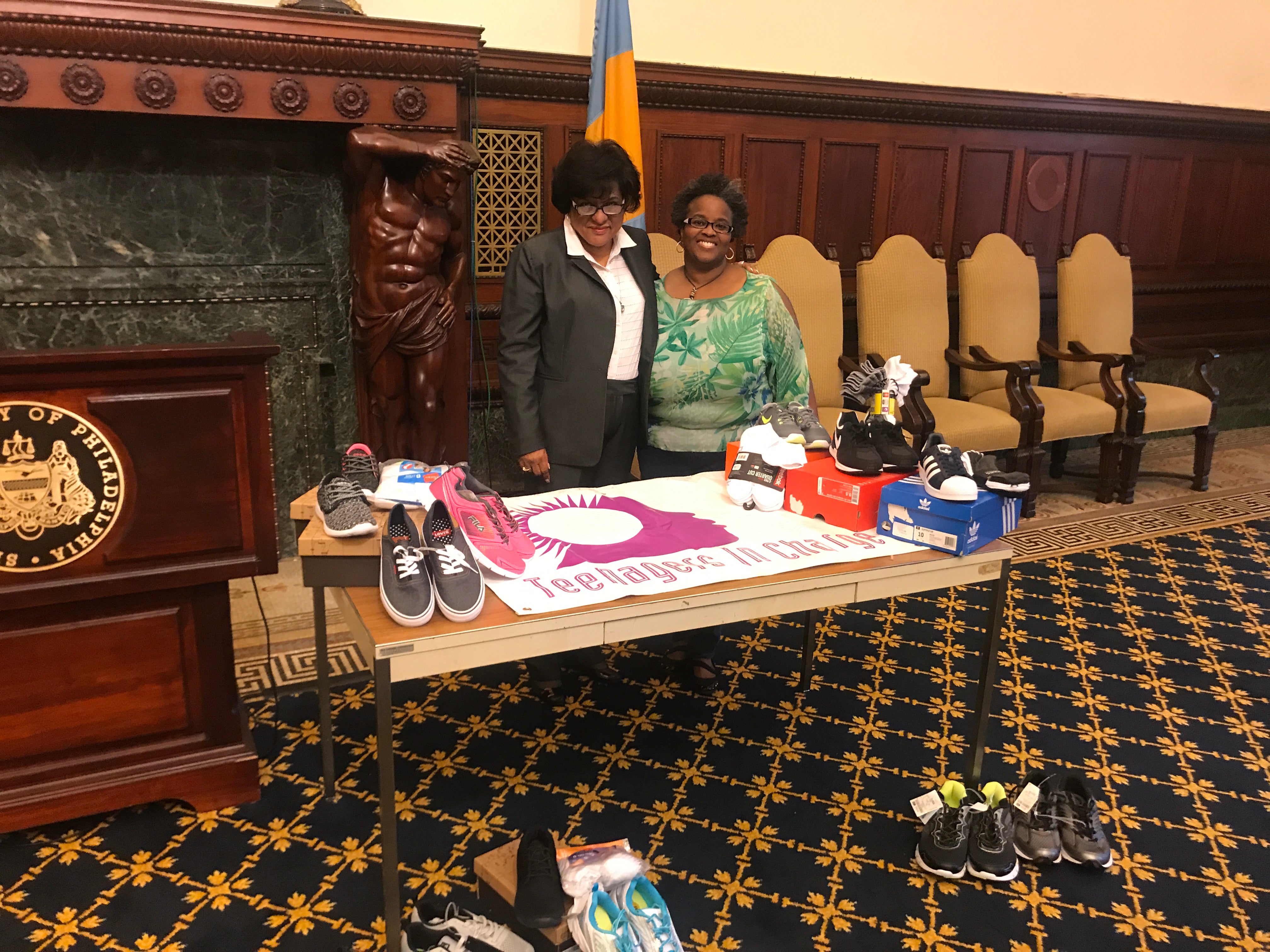  Councilwoman Jannie Blackwell and Judith McDaniel talk about the effort to collect 1,000 pairs of sneakers for homeless youth. (Courtesy Teresa Lundy) 