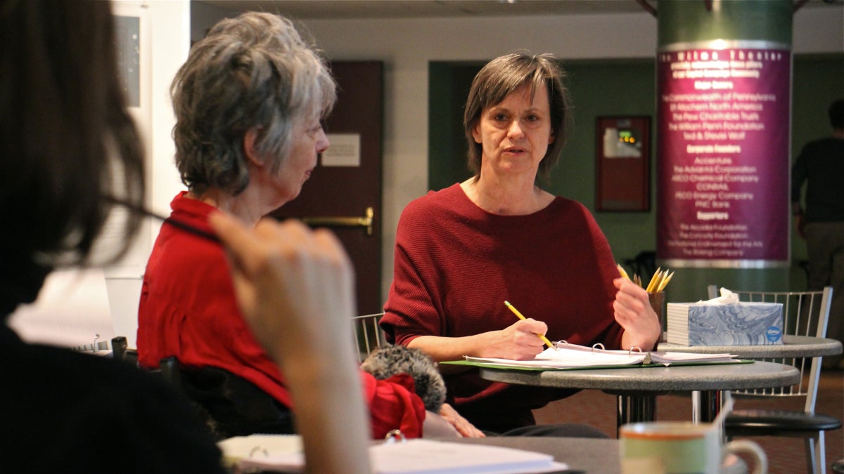  Blanka Zizka goes over notes with her actors before rehearsal for ''Adapt!'' at Wilma Theater. (Emma Lee/WHYY) 