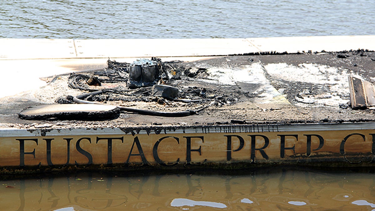 A suspicious fire damaged four launches and a dock at the Camden County Boathouse. All four boats belonged to the Bishop Eustace Prep crew team. (Emma Lee/for NewsWorks)