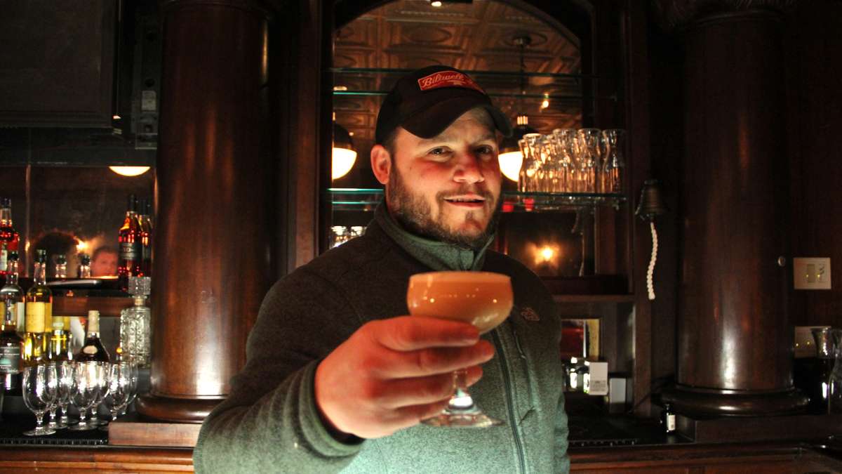 Cocktail consultant Erich Weiss experiments with a Krider Flip, a cocktail named for the man who ran a gun shop down the street from the original Bookbinders. (Emma Lee/WHYY)