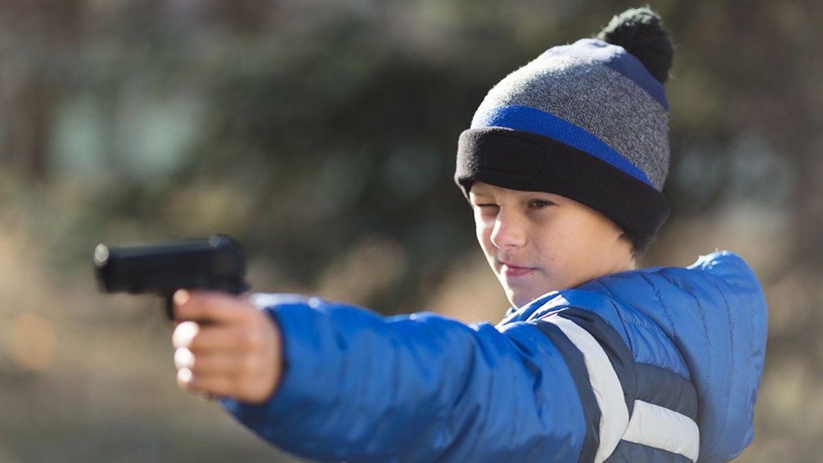  Boy holding a toy gun. (Big Stock file photo) 