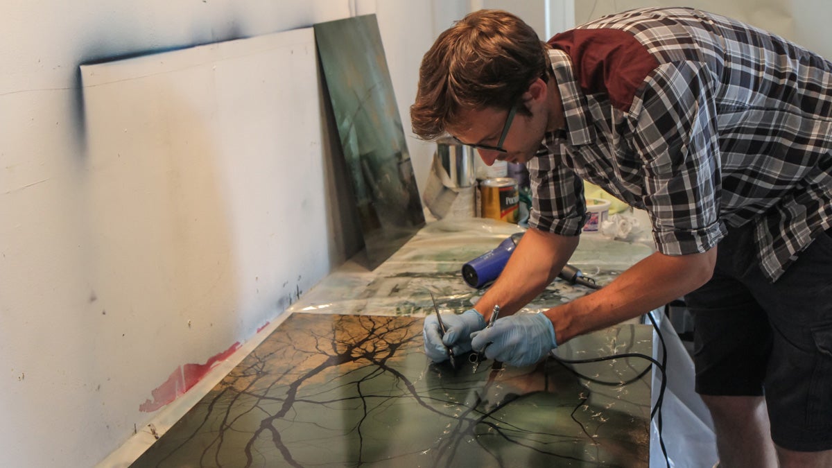 Greg Dunn is a neuroscientist and artist who depicts neurons in mediums such as microetchings and ink. (Kimberly Paynter/WHYY) 