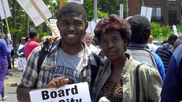  Brandon Dixon and his mother are shown at Girard College in Philadelphia on June 14, protesting a plan to eliminate grades nine through 12 at the end of next year. (Image courtesy of Brandon Dixon.) 