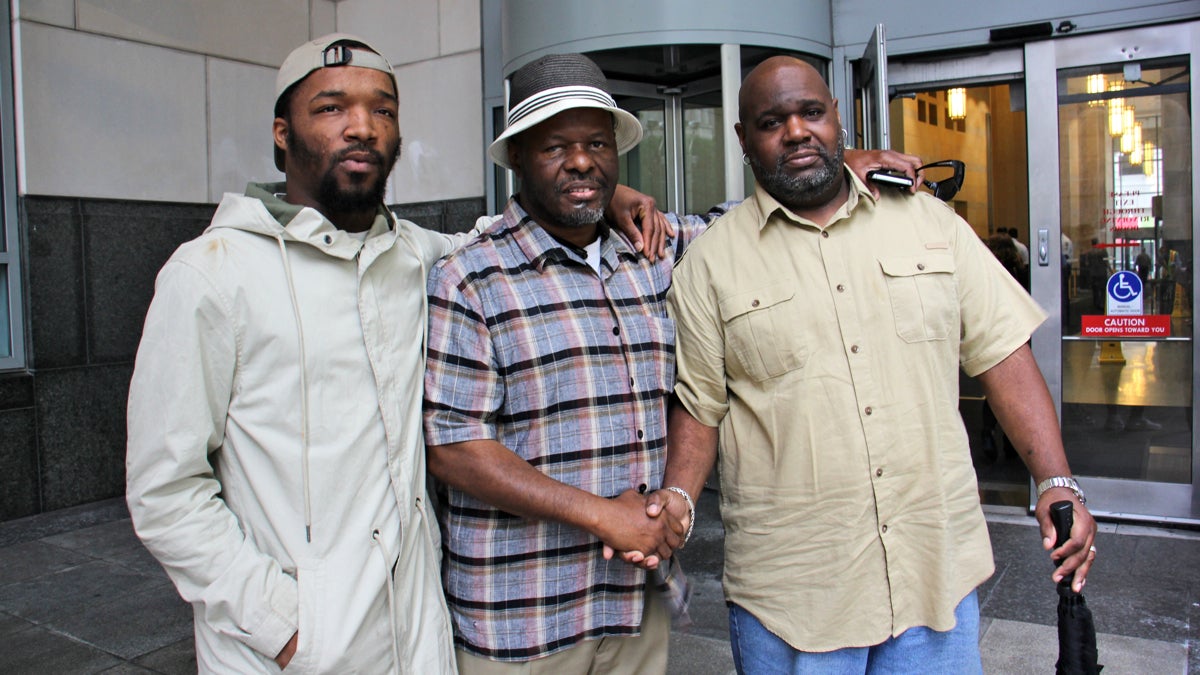  Members of Kevin Brinkley's family (from left) nephew James Cade, uncle Kevin Brinkley and cousin Sheldon Stroman, leave court together after a resentencing hearing. (Emma Lee/WHYY) 