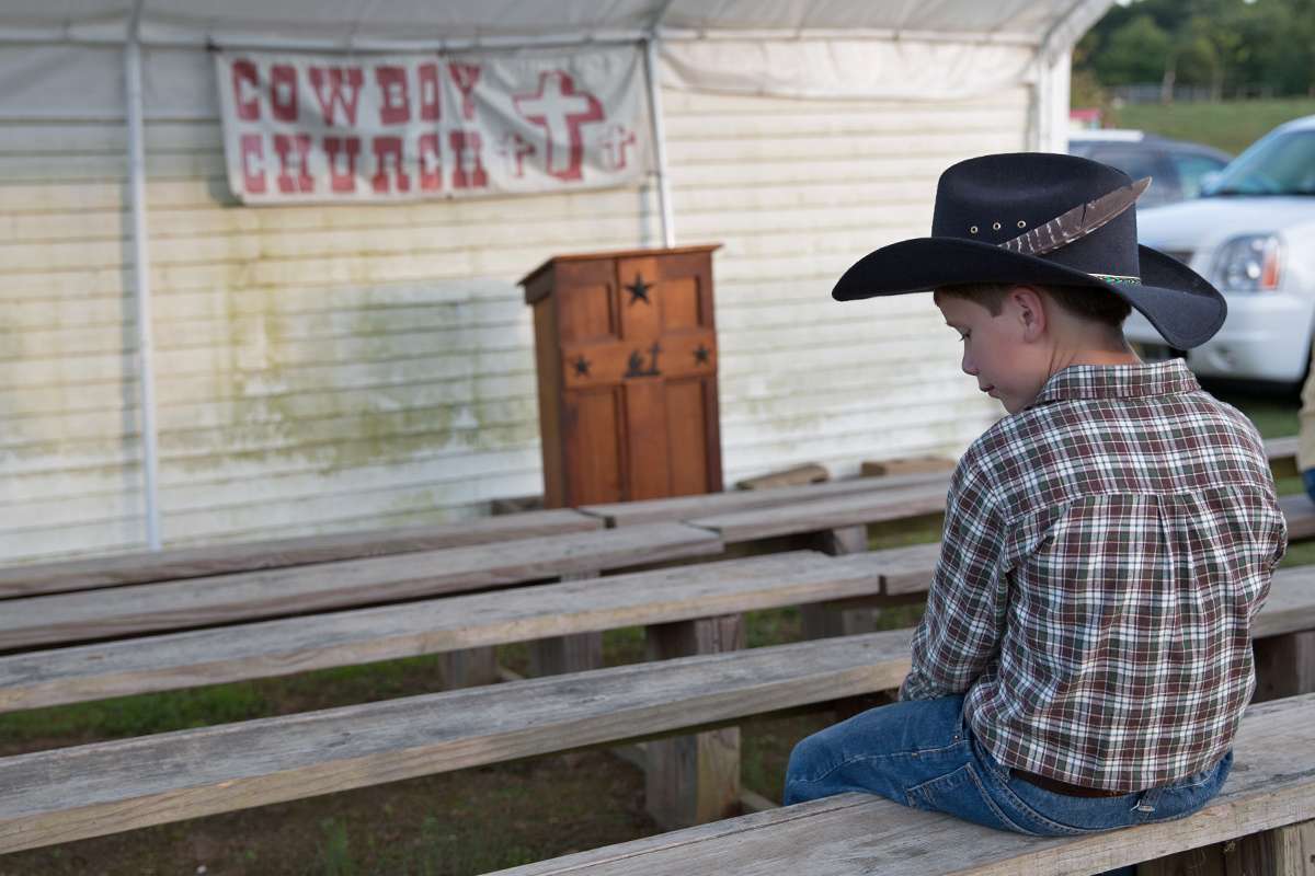 Junior bull rider, John Headley, 10, said he likes to say a prayer before he gets on a bull. (Lindsay Lazarski/WHYY)