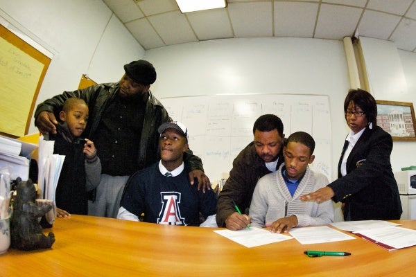 The letters were signed in Germantown High School Principal Margaret Mullen-Bavwidinsi's crowded office Wednesday morning. (Bas Slabbers/for NewsWorks)