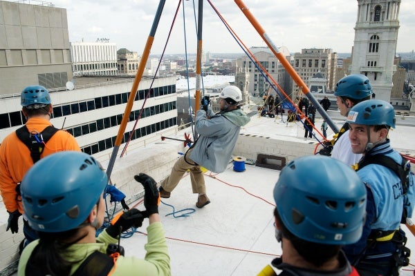 <p><p>Rappellers are given instructions before heading down the face of 1515 Market St. (Bas Slabbers/for NewsWorks)</p></p>

