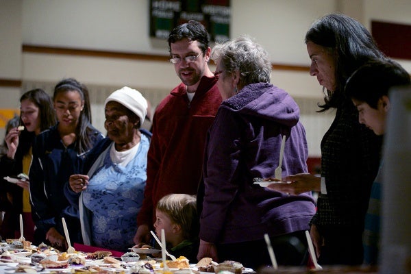 <p><p>People look at the table where the desserts are displayed. (Bas Slabbers/for NewsWorks)</p></p>
