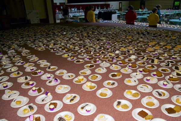 <p><p>Plates with desserts are placed on the stage before being handed out. (Bas Slabbers/for NewsWorks)</p></p>

