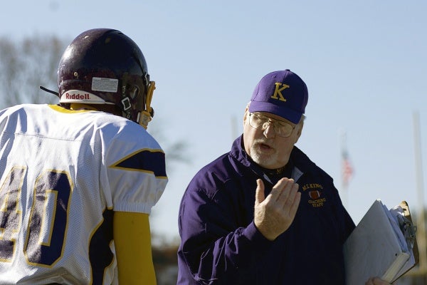 <p><p>MLK Cougars Head Coach John Sheroda speaking to a player on the sideline. (Bas Slabbers/for NewsWorks)</p></p>
